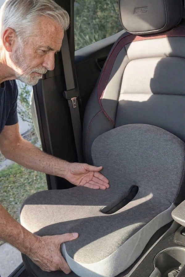 Hands lifting the cushion by the back panel